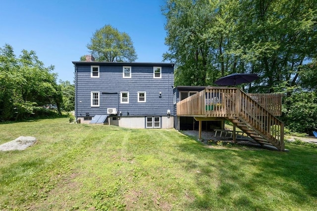 30 Eastview Rd, Hopkinton, MA 01748 - rear view of house with a chimney, a wooden deck, stairs, and a lawn