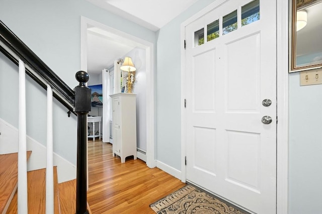 30 Eastview Rd, Hopkinton, MA 01748 - entrance foyer featuring light wood finished floors, stairway, and baseboard heating