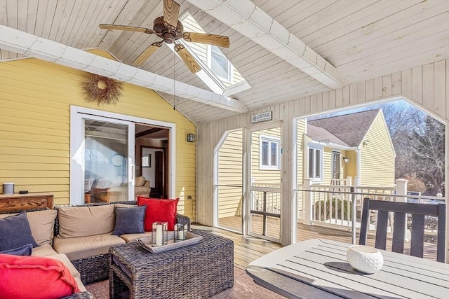 deck with ceiling fan and an outdoor hangout area