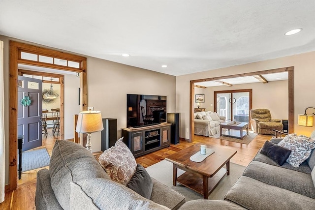 living room featuring recessed lighting and light wood-style flooring