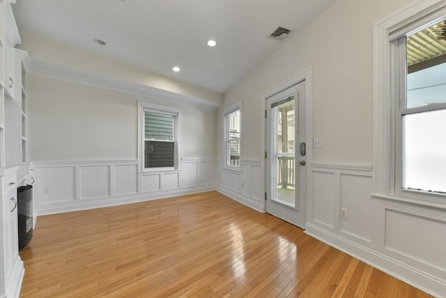 16 Emerson St Unit 1, Boston, MA 02127 - foyer with wainscoting, light wood-style floors, recessed lighting, and a decorative wall