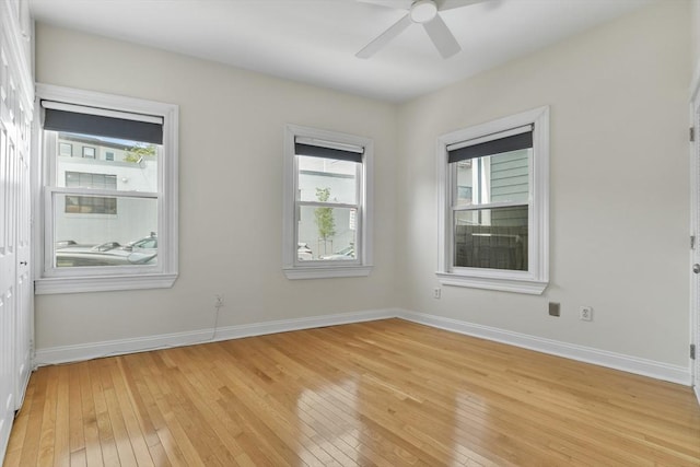 16 Emerson St Unit 1, Boston, MA 02127 - empty room featuring light wood-style floors, plenty of natural light, and ceiling fan