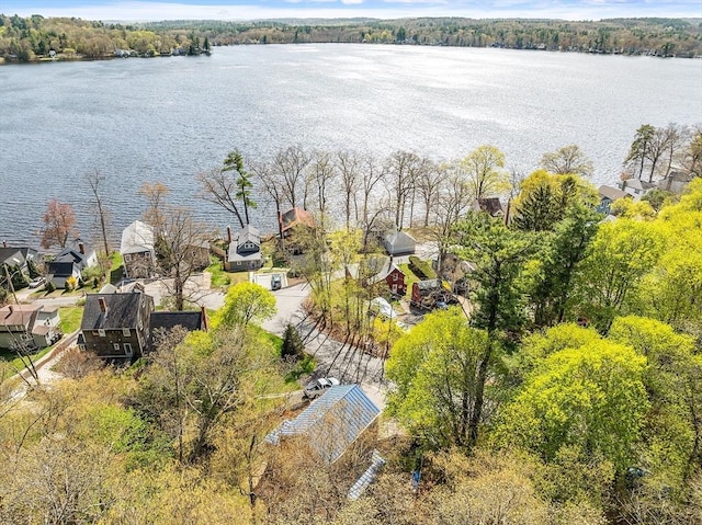 drone / aerial view featuring a residential view and a water view