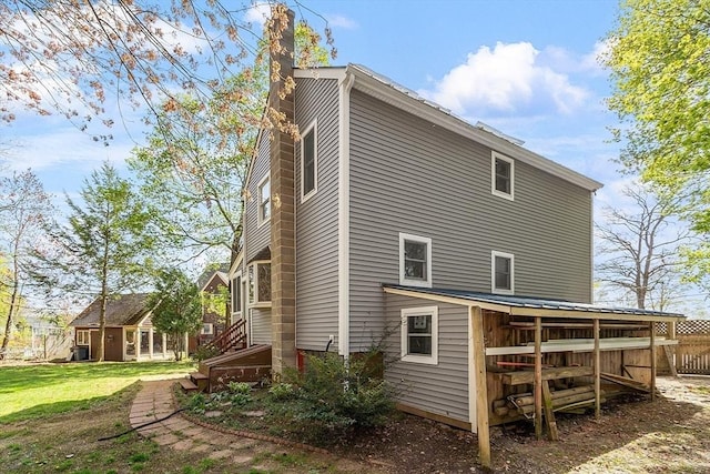 rear view of property with a chimney