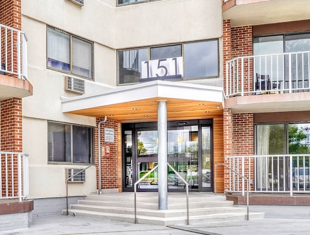 property entrance with a balcony