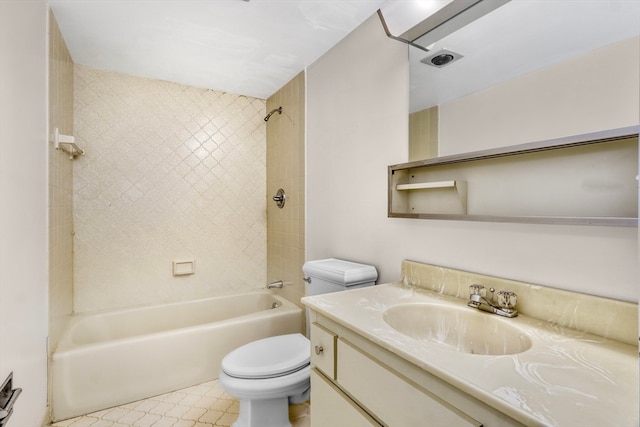 full bathroom featuring toilet, tiled shower / bath combo, and vanity