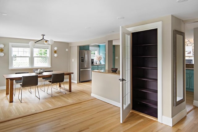 28 Ridge St, Arlington, MA 02474 - dining area featuring light wood finished floors and baseboards