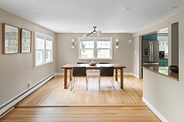 28 Ridge St, Arlington, MA 02474 - dining space featuring baseboard heating, light wood-style floors, and recessed lighting