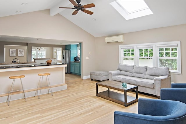 28 Ridge St, Arlington, MA 02474 - living area with a wall mounted AC, a skylight, beam ceiling, light wood finished floors, and healthy amount of natural light