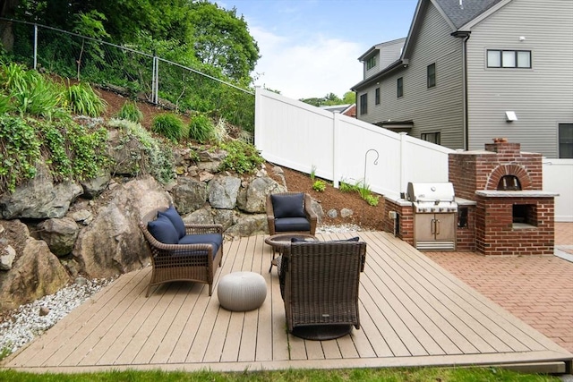 28 Ridge St, Arlington, MA 02474 - view of patio / terrace with a deck, exterior kitchen, and a brick fireplace
