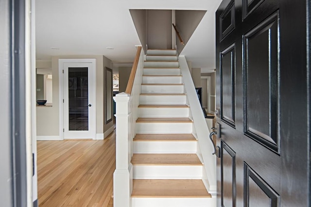 28 Ridge St, Arlington, MA 02474 - stairway featuring wood finished floors and baseboards