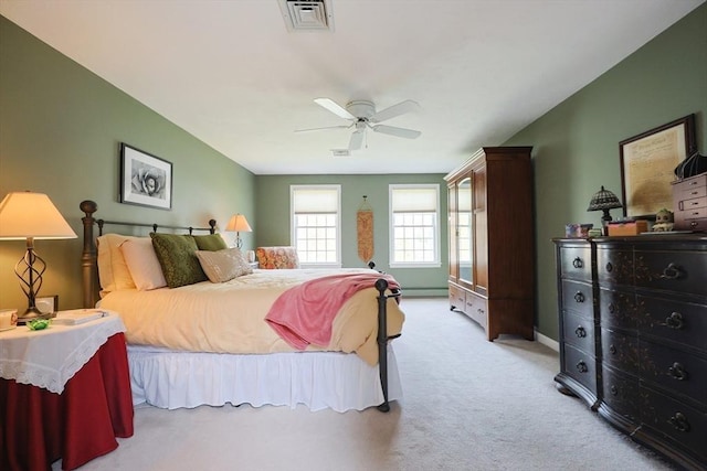 carpeted bedroom with ceiling fan and visible vents