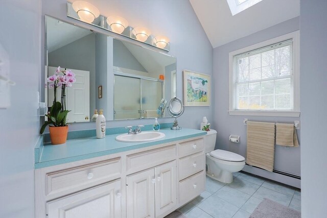 bathroom featuring baseboard heating, a stall shower, vanity, tile patterned floors, and lofted ceiling with skylight