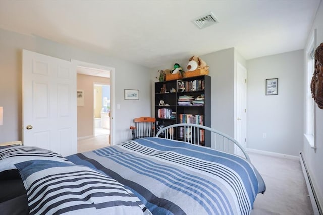 carpeted bedroom featuring baseboards, a baseboard heating unit, and visible vents