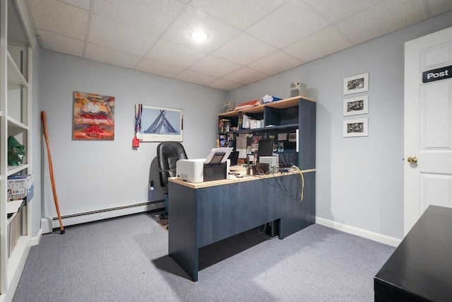 office space featuring baseboards, a drop ceiling, a baseboard heating unit, and carpet flooring