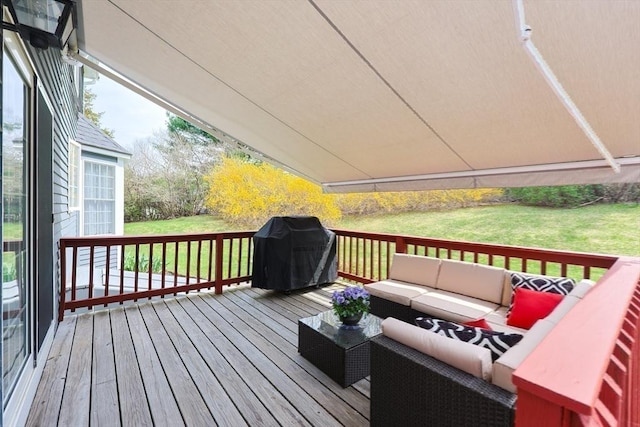 deck featuring a lawn, an outdoor hangout area, and area for grilling