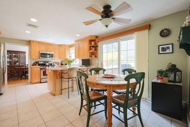 dining room featuring visible vents, a ceiling fan, light tile patterned flooring, and recessed lighting