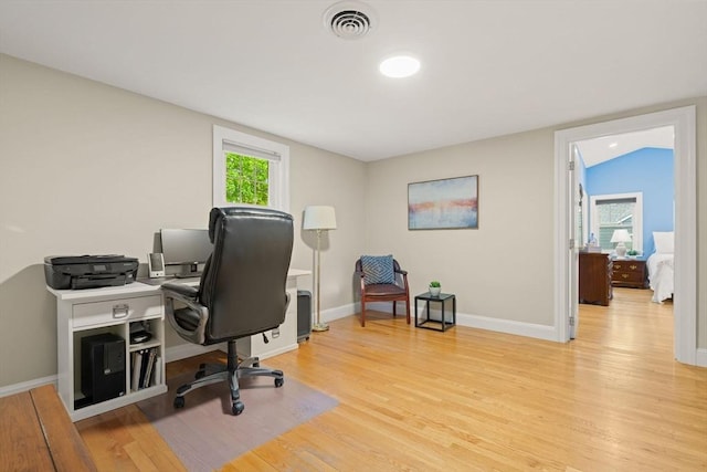 office space featuring light wood-style floors and baseboards