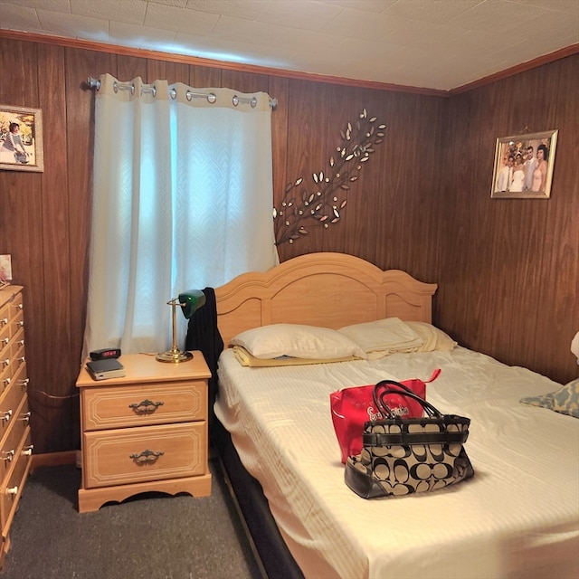 carpeted bedroom with wood walls