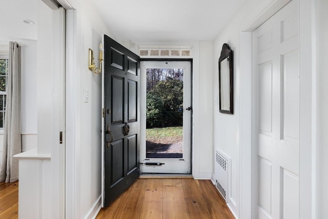 doorway to outside with hardwood / wood-style flooring and plenty of natural light