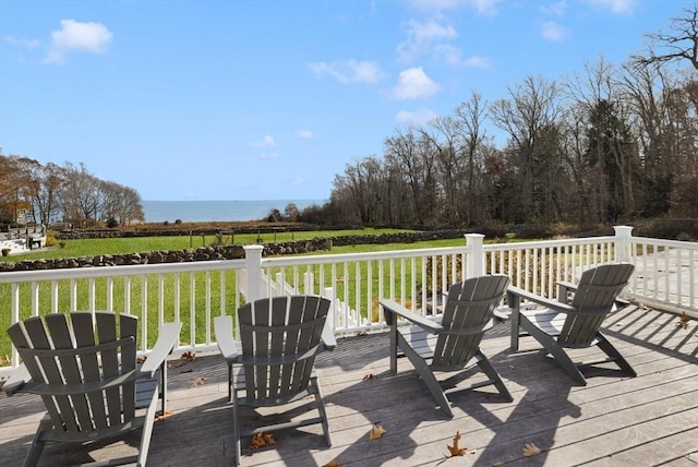 deck featuring a yard and a water view