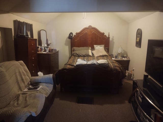 carpeted bedroom featuring vaulted ceiling