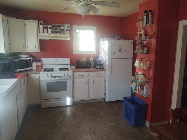 kitchen featuring ceiling fan, white cabinetry, sink, and white appliances