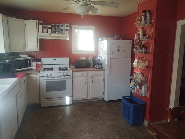 kitchen with ceiling fan, white cabinetry, sink, and white appliances