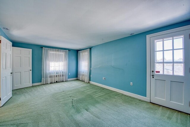 unfurnished bedroom with carpet and baseboards