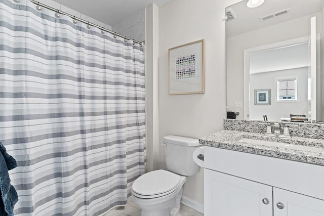 full bathroom featuring toilet, vanity, and a shower with curtain