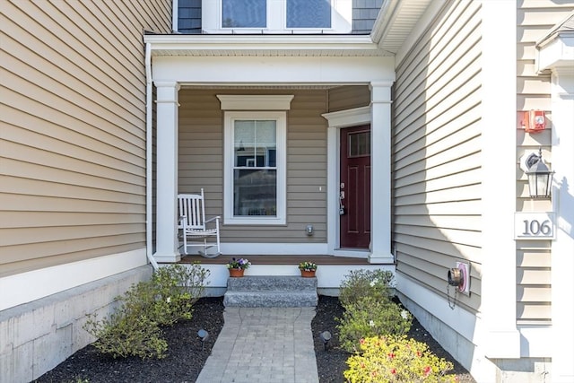 doorway to property with covered porch