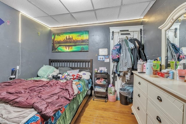 215 Beacon St, Worcester, MA 01610 - bedroom with a paneled ceiling and light wood-style floors