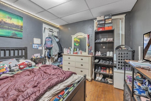 215 Beacon St, Worcester, MA 01610 - bedroom featuring a paneled ceiling, wood-type flooring, and a textured wall