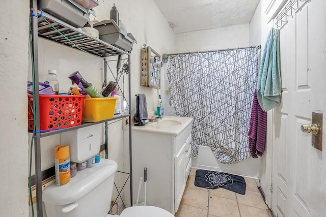 215 Beacon St, Worcester, MA 01610 - full bathroom featuring toilet, vanity, and tile patterned floors