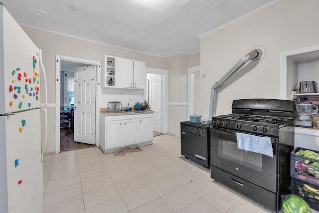 215 Beacon St, Worcester, MA 01610 - kitchen with black range with gas stovetop, freestanding refrigerator, white cabinetry, crown molding, and light countertops