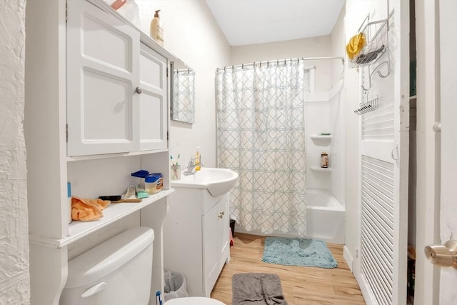 215 Beacon St, Worcester, MA 01610 - full bath with vanity, wood finished floors, toilet, and shower / tub combo