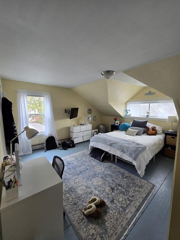 bedroom featuring vaulted ceiling and baseboard heating