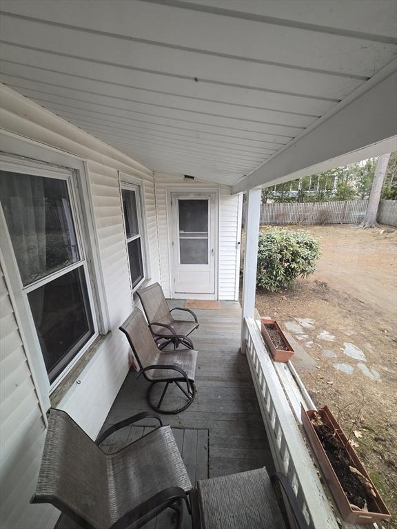 wooden deck featuring fence