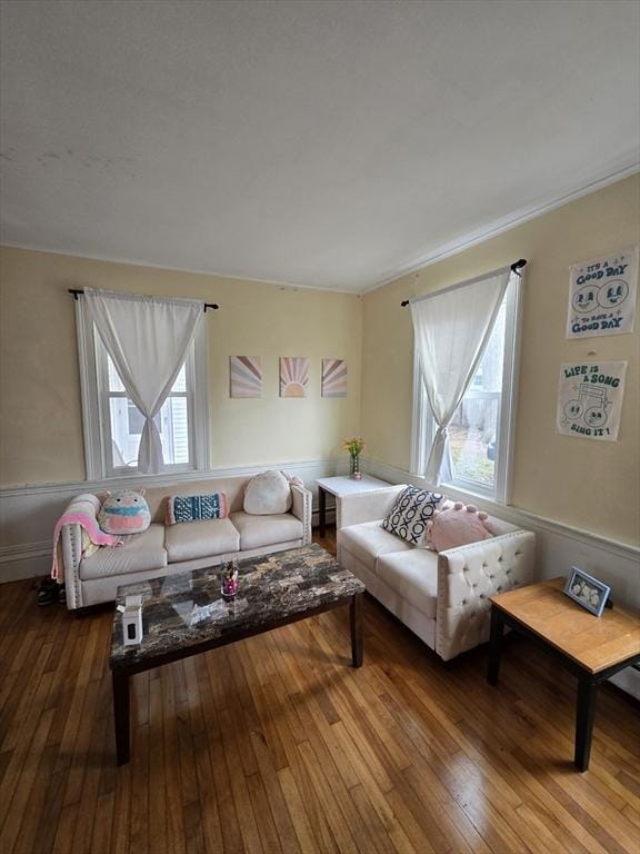 living area with hardwood / wood-style flooring