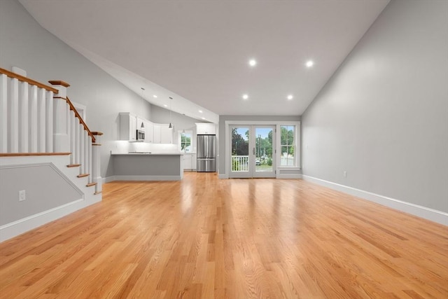 unfurnished living room with light hardwood / wood-style flooring