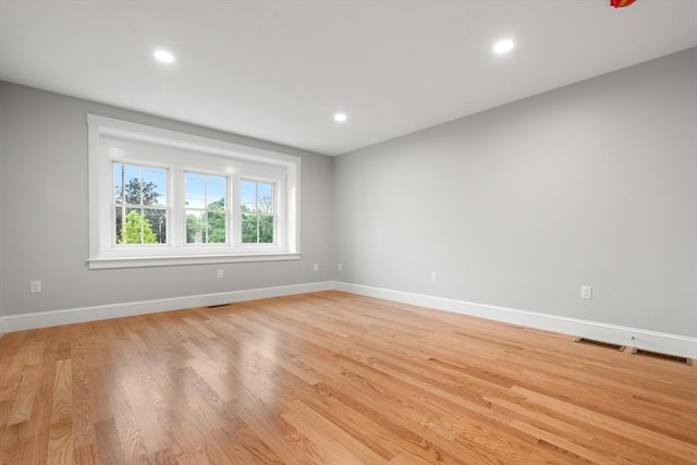 spare room featuring light wood-type flooring