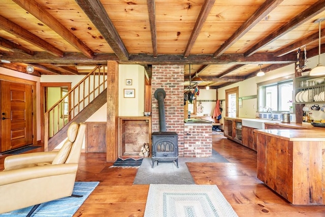 78 Wickett Pond Rd, Wendell, MA 01379 - living room featuring hardwood / wood-style floors, a wood ceiling with exposed beams, stairway, and a wood stove