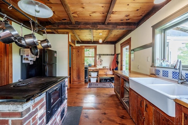 78 Wickett Pond Rd, Wendell, MA 01379 - kitchen with a wood ceiling with exposed beams, freestanding refrigerator, and dark wood-type flooring