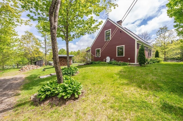 78 Wickett Pond Rd, Wendell, MA 01379 - view of home's exterior with a chimney and a yard
