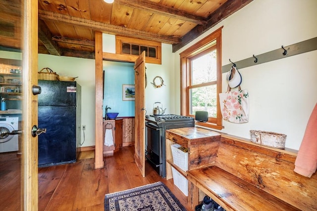 78 Wickett Pond Rd, Wendell, MA 01379 - kitchen with black appliances, washer / dryer, a wood ceiling with exposed beams, and wood-type flooring