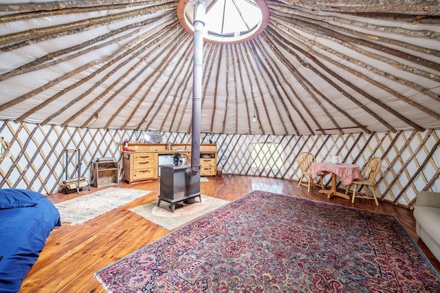 78 Wickett Pond Rd, Wendell, MA 01379 - unfurnished living room featuring a wood stove and wood finished floors