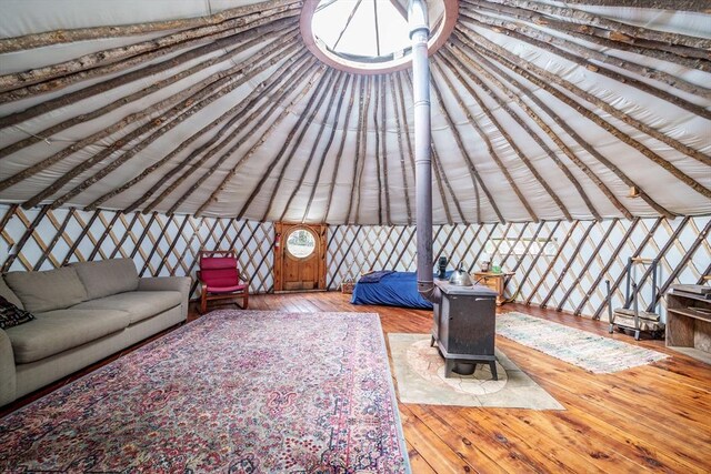 78 Wickett Pond Rd, Wendell, MA 01379 - living area with wood-type flooring and a wood stove