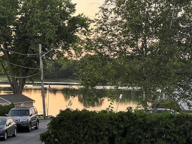 view of side of home with a water view