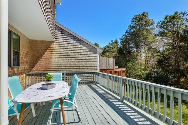 deck with outdoor dining area
