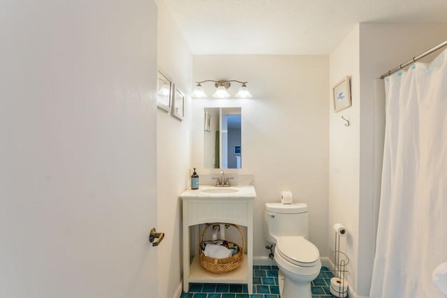 bathroom with tile patterned flooring, curtained shower, baseboards, vanity, and toilet
